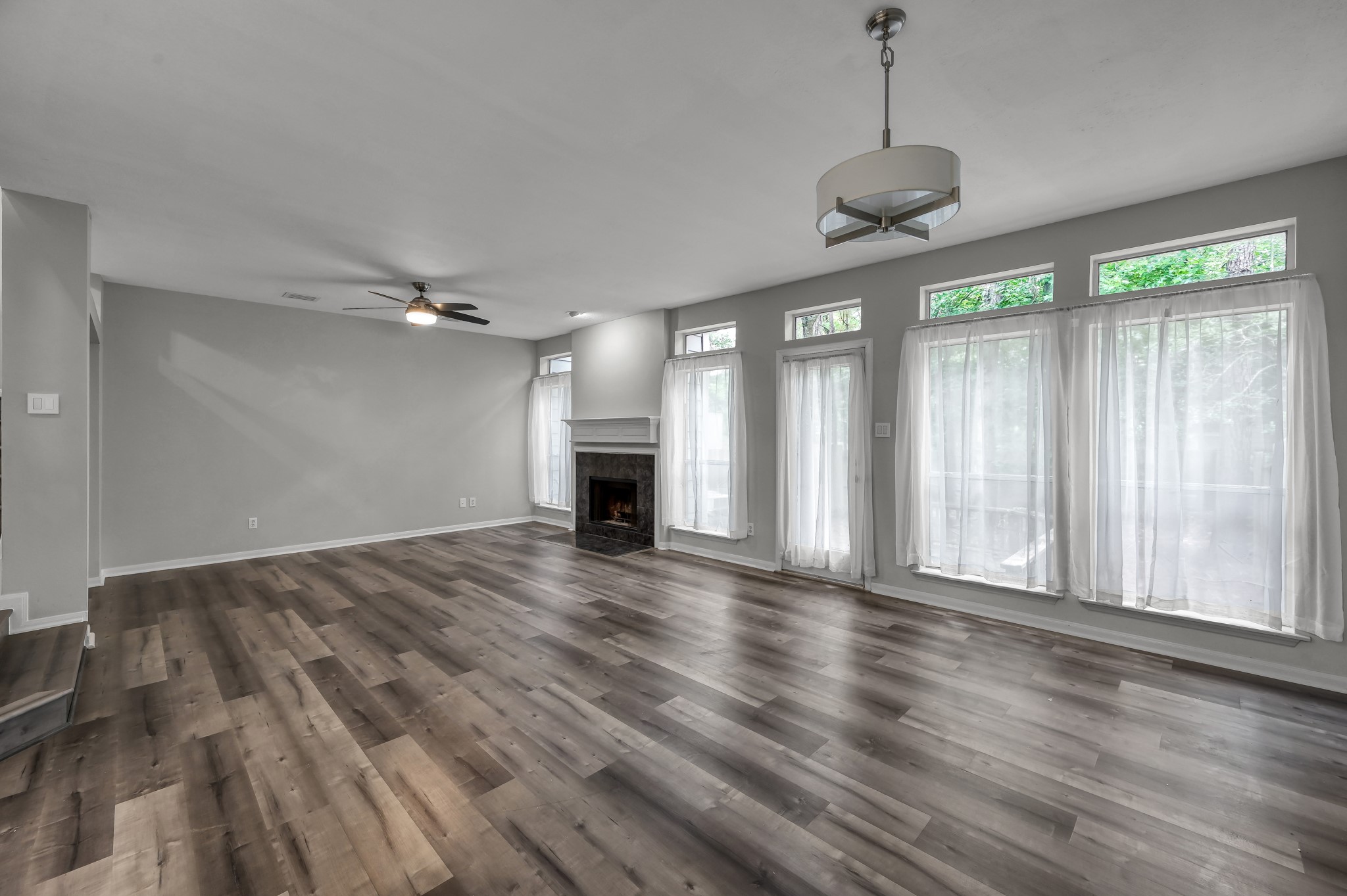 23 Alderon Woods Place Spring, TX 77382 - Photo 13 of 25 a view of an empty room with wooden floor and a window