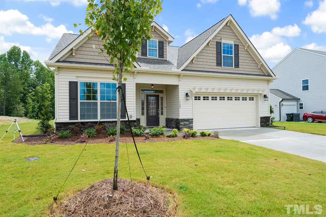 59 Ramsgate Drive Clayton, NC 27520 - Photo 1 of 4 a view of a house with swimming pool and a yard