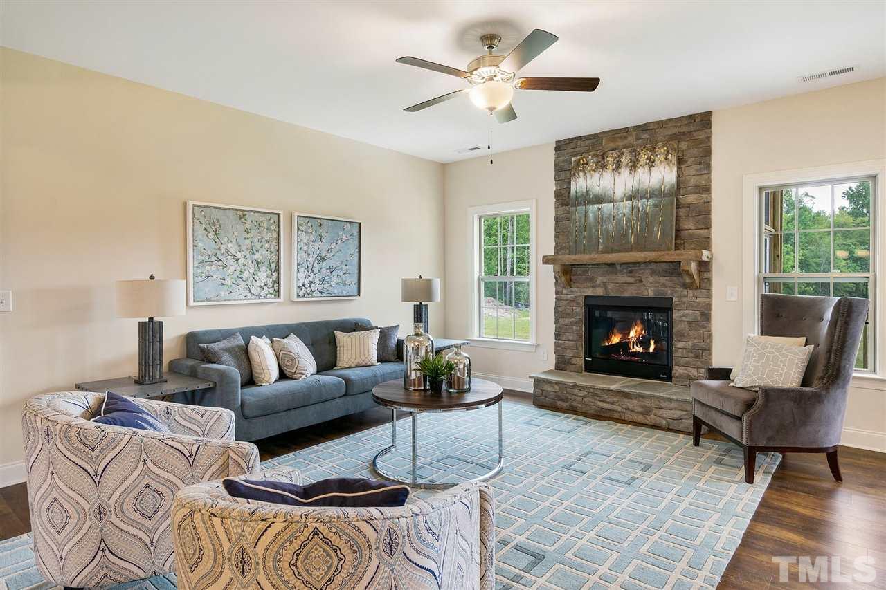 59 Ramsgate Drive Clayton, NC 27520 - Photo 3 of 4 a living room with furniture and a fireplace
