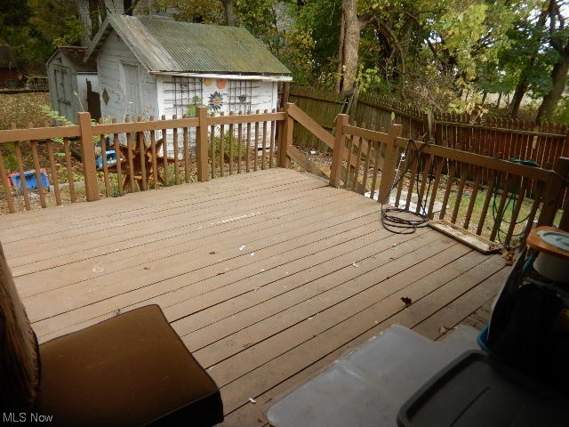 1302 Duncan Street Southwest Massillon, OH 44647 - Photo 22 of 22 Wooden deck featuring a shed