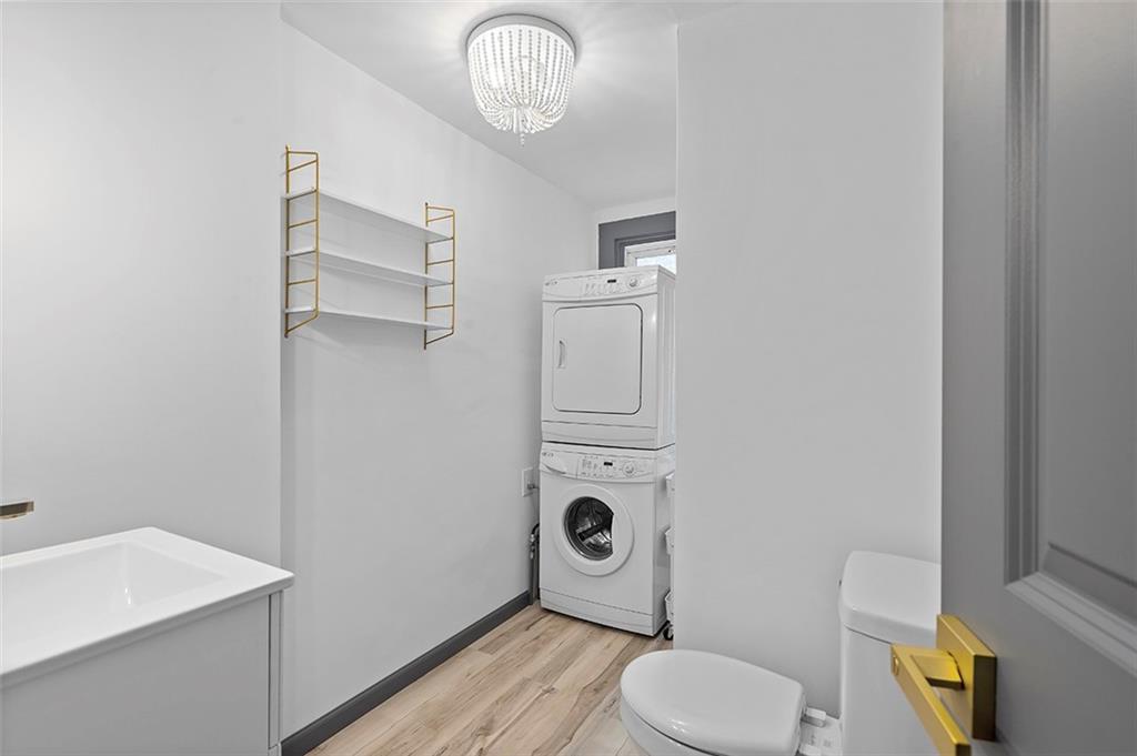406 Center Road Monroeville, PA 15146 - Photo 11 of 25 a bathroom with a toilet and a sink