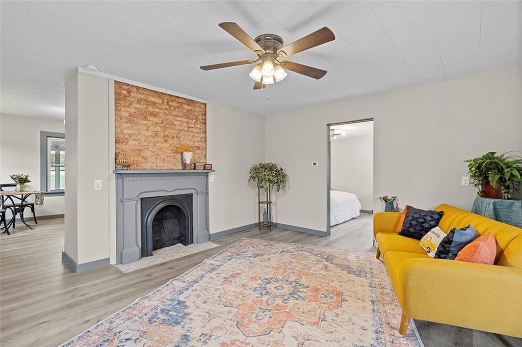 406 Center Road Monroeville, PA 15146 - Photo 13 of 25 a living room with furniture and a fireplace
