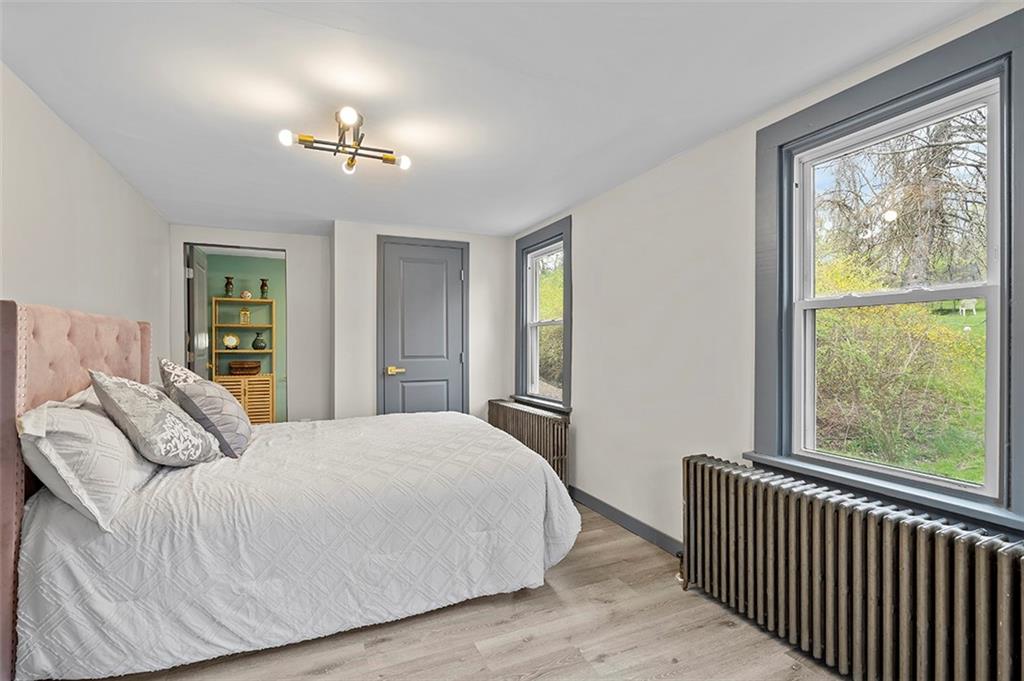 406 Center Road Monroeville, PA 15146 - Photo 15 of 25 a bedroom with a large bed and a window