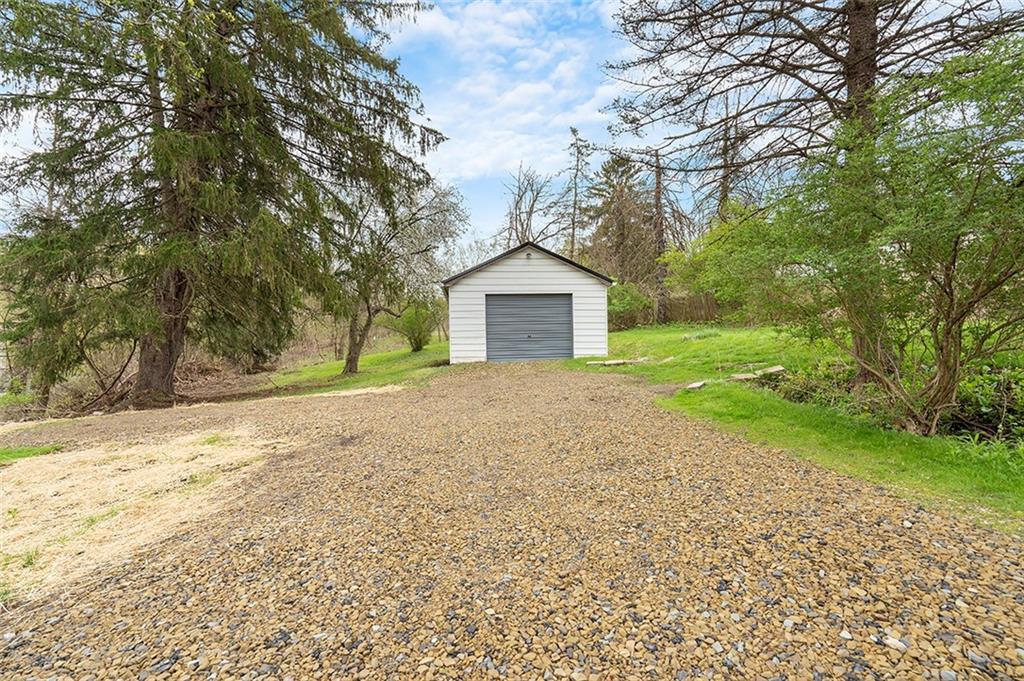 406 Center Road Monroeville, PA 15146 - Photo 2 of 25 a front view of a house with a yard and garage