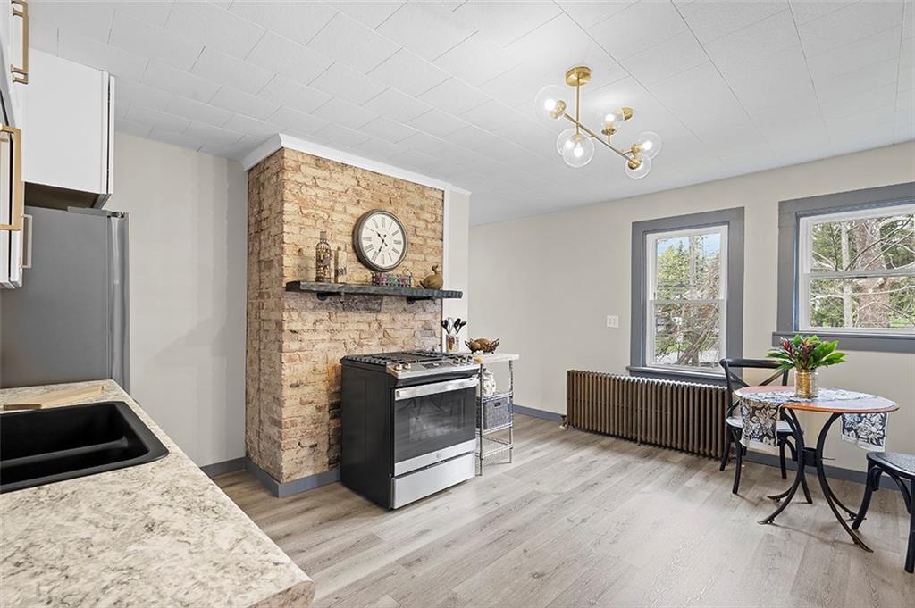 406 Center Road Monroeville, PA 15146 - Photo 8 of 25 a living room with furniture and a fireplace