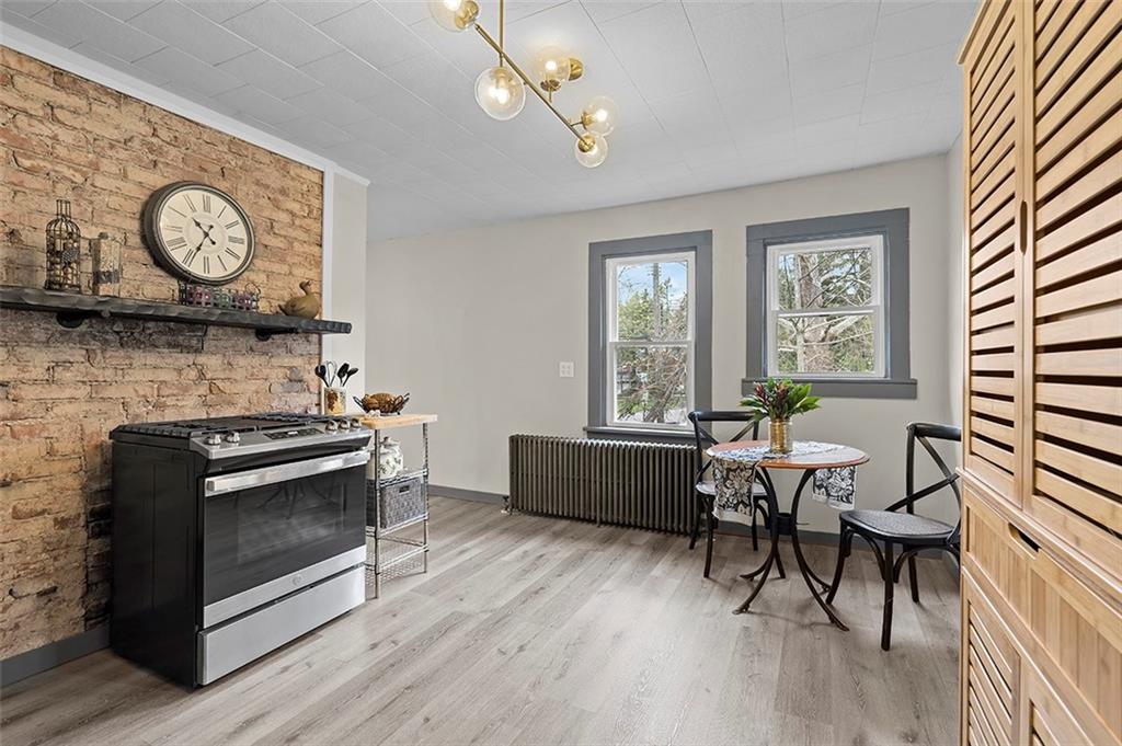 406 Center Road Monroeville, PA 15146 - Photo 9 of 25 a living room with furniture and a wooden floor