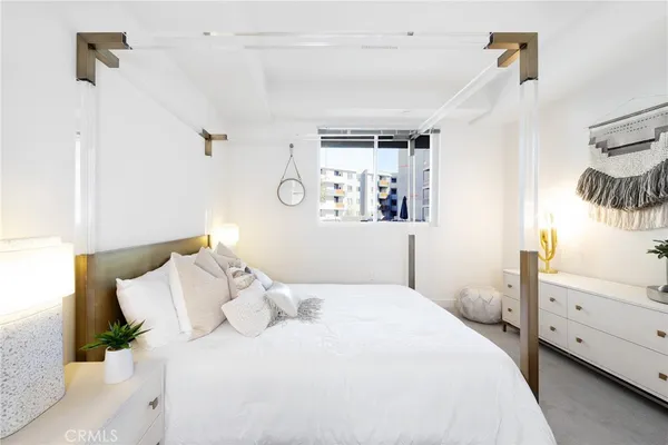 a bedroom with a bed and a cabinets