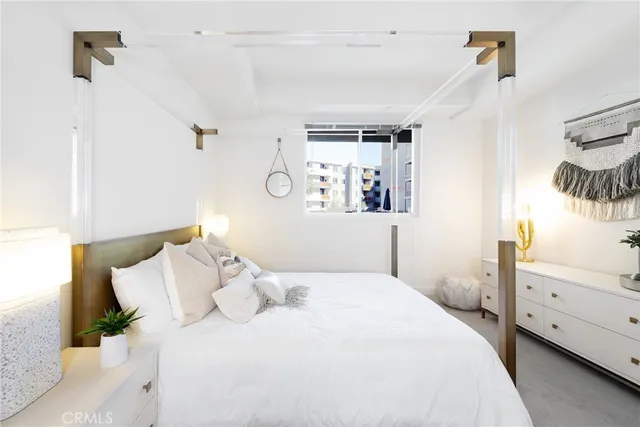 a bedroom with a bed and a cabinets