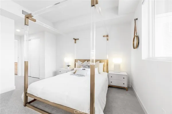 a bedroom with a bed and a cabinets