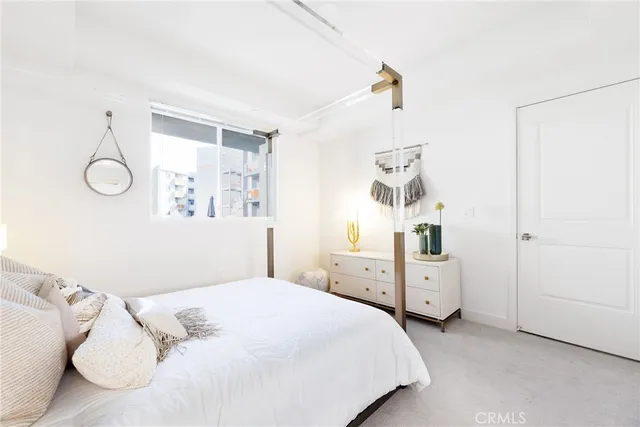 a bedroom with a bed and a closet