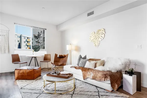 a living room with furniture and a table