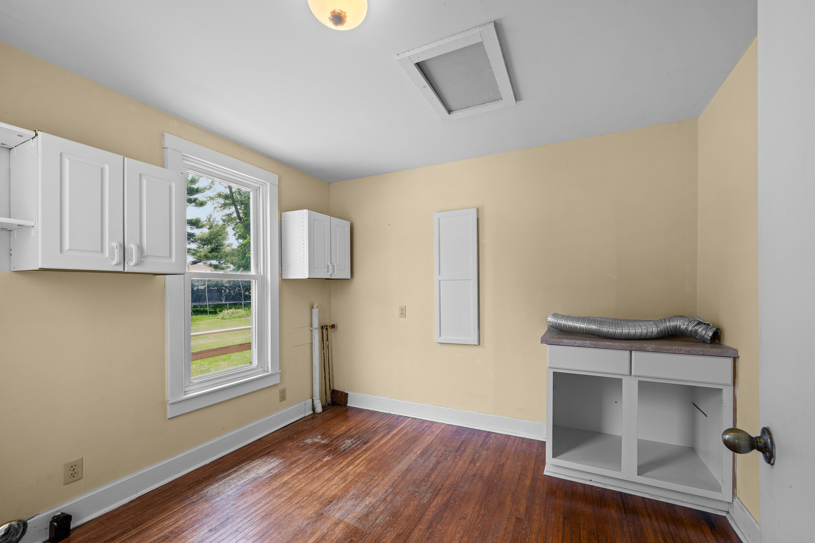 1202 20th Avenue Viola, IL 61486 - Photo 21 of 50 a view of room with window and wooden floor