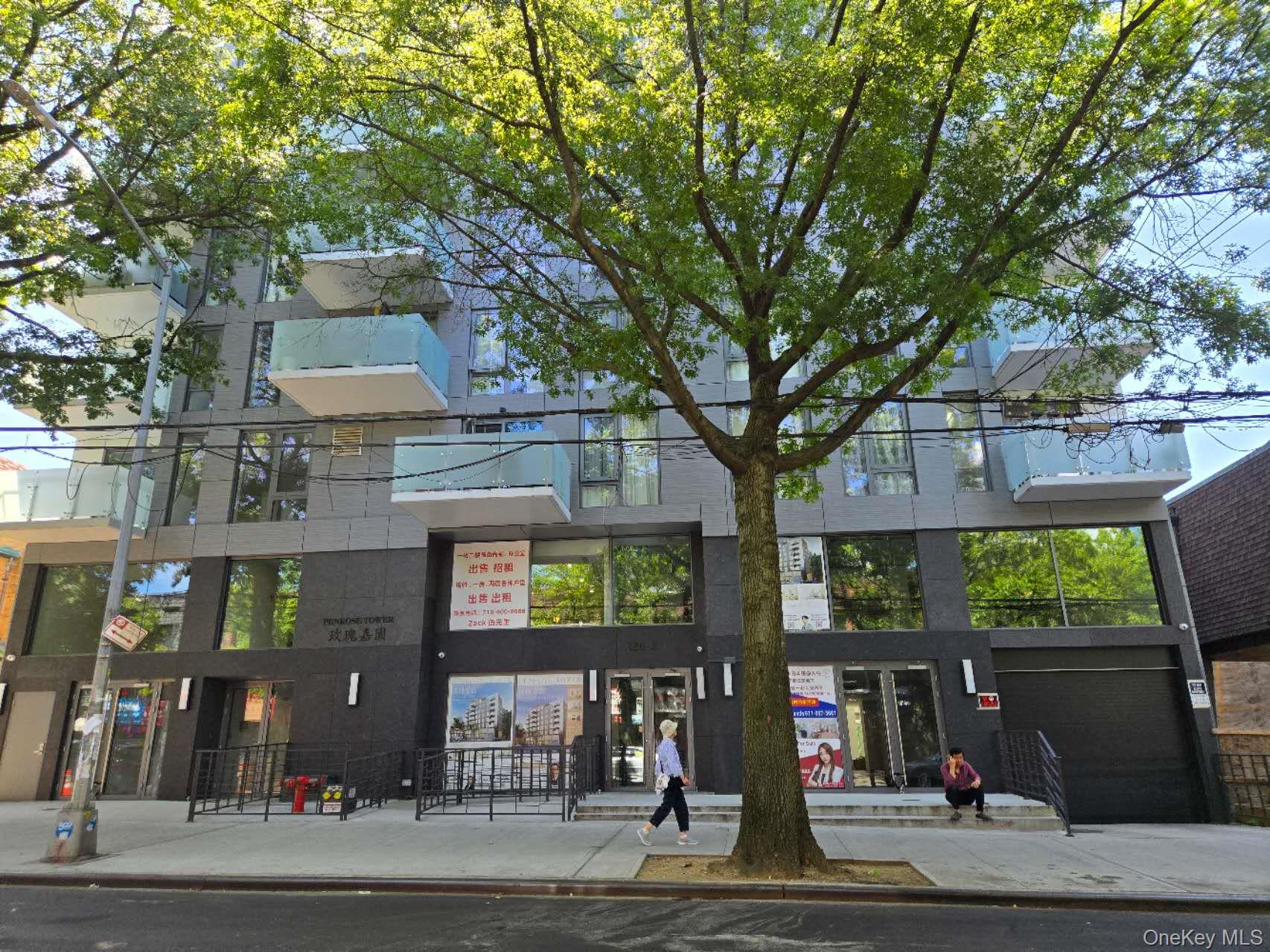 136-80 41st Avenue, Unit 6H Queens, NY 11355 - Photo 1 of 11 a front view of a building with street view