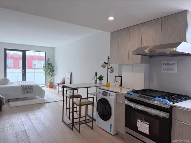 a kitchen with a stove a sink and a stove top oven