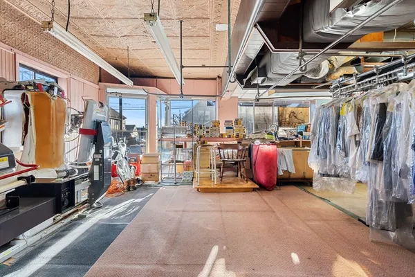 a view of a kitchen with a sink and cabinets