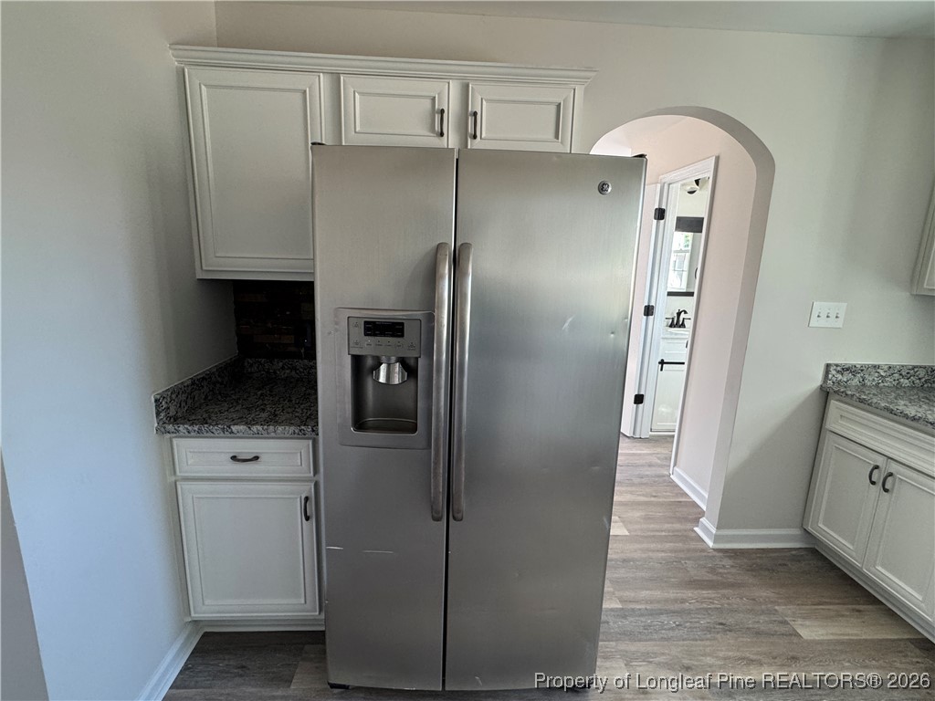 1950 Tingen Road Lillington, NC 27546 - Photo 18 of 50 a kitchen with metallic refrigerator and cabinets