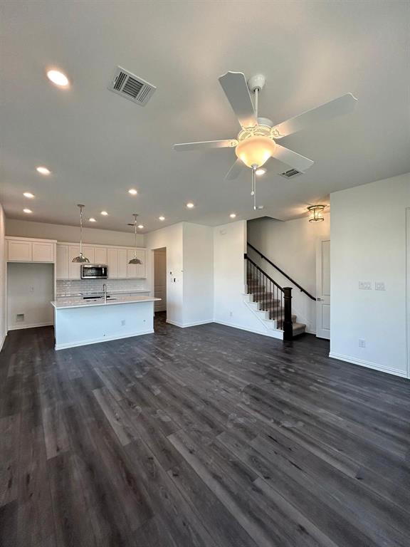4704 Craymore Road Dallas, TX 75228 - Photo 4 of 14 a view of an empty room with a kitchen