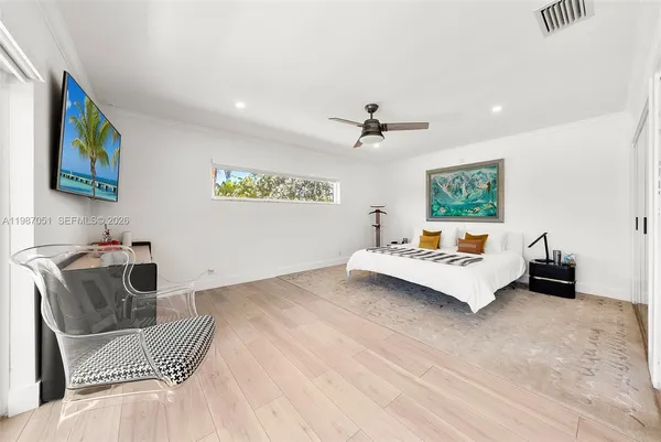 a living room with furniture and white walls