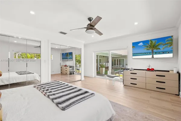 a bathroom with a double vanity sink mirror and shower