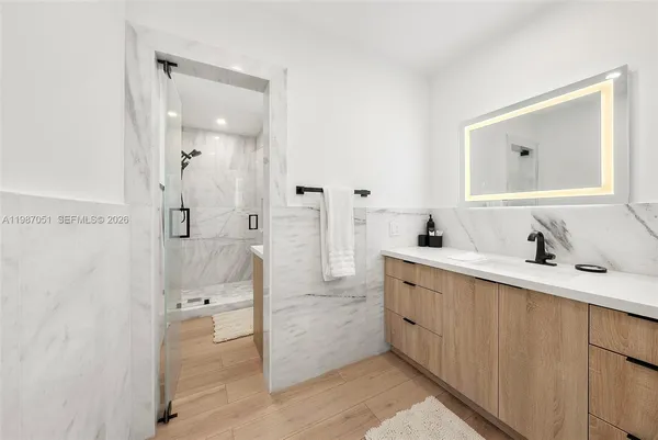 a bathroom with a sink and a mirror