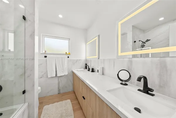 a view of a livingroom with furniture and wooden floor