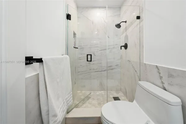 a view of a swimming pool with seating space