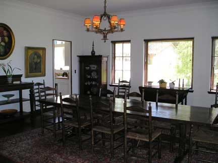 1811 El Encanto Road Santa Barbara, CA 93103 - Photo 7 of 14 a dining room with wooden floor a chandelier a wooden table and chairs