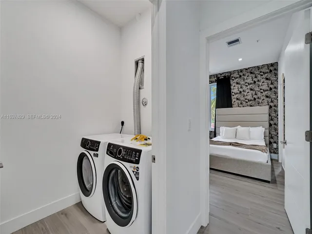 a bedroom with a bed and a cabinets