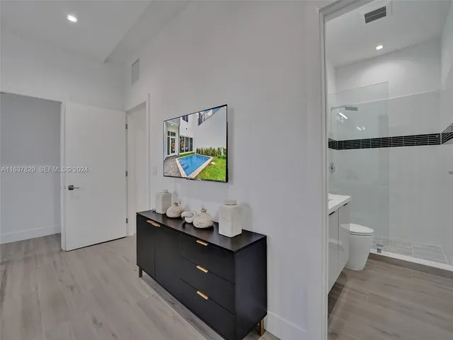 a bedroom with a bed and a cabinets