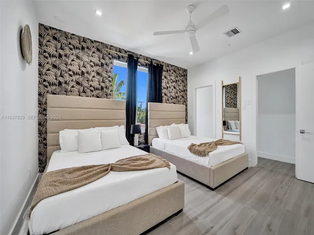 a room with a wooden floor and a toilet