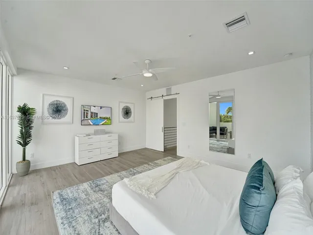 a room with a potted plant and a sink