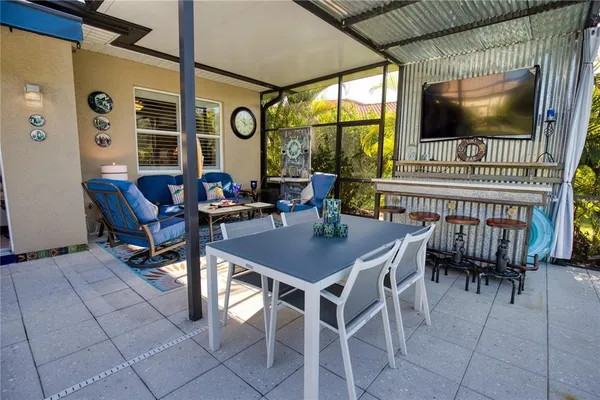 a view of a livingroom with furniture and a window