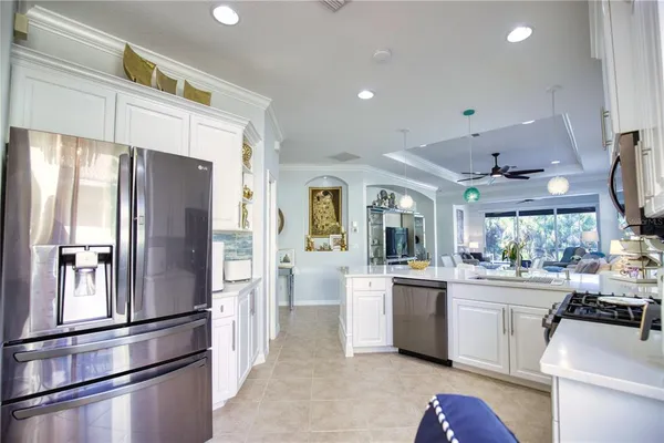 a kitchen with stainless steel appliances a refrigerator sink and stove