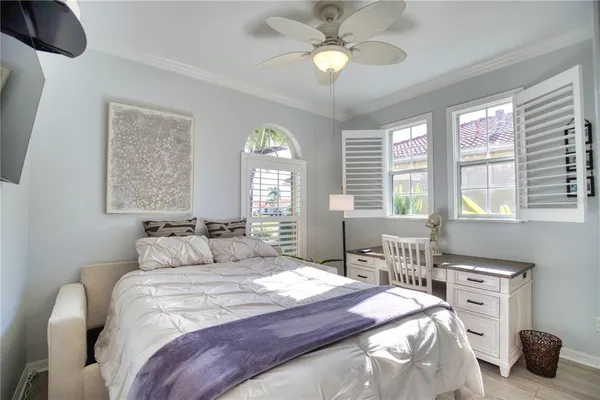 a bedroom with a bed and a table