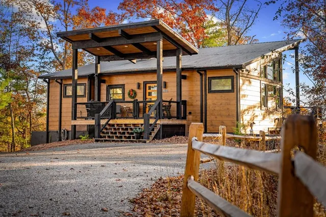 a view of patio with table and chairs and potted plants