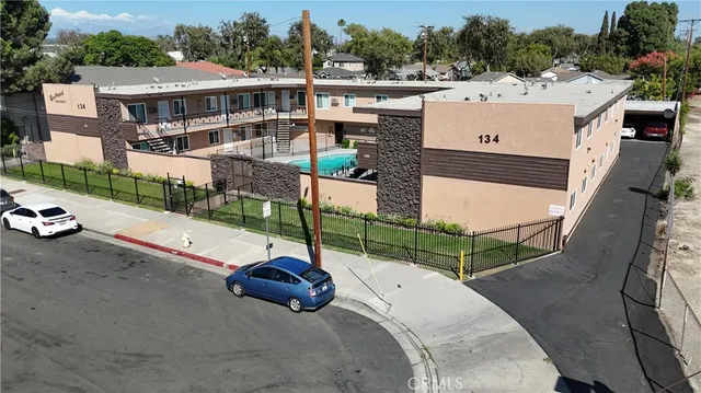 a view of a house with a yard and sitting area