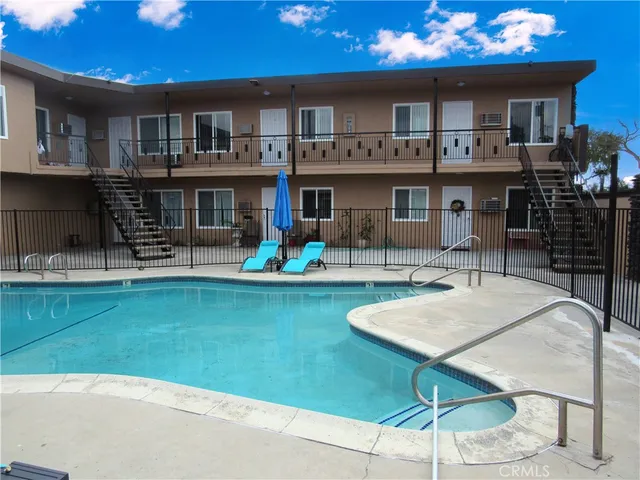 a view of a chairs and table in a patio