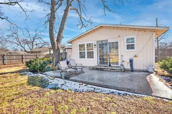 a view of backyard with large trees