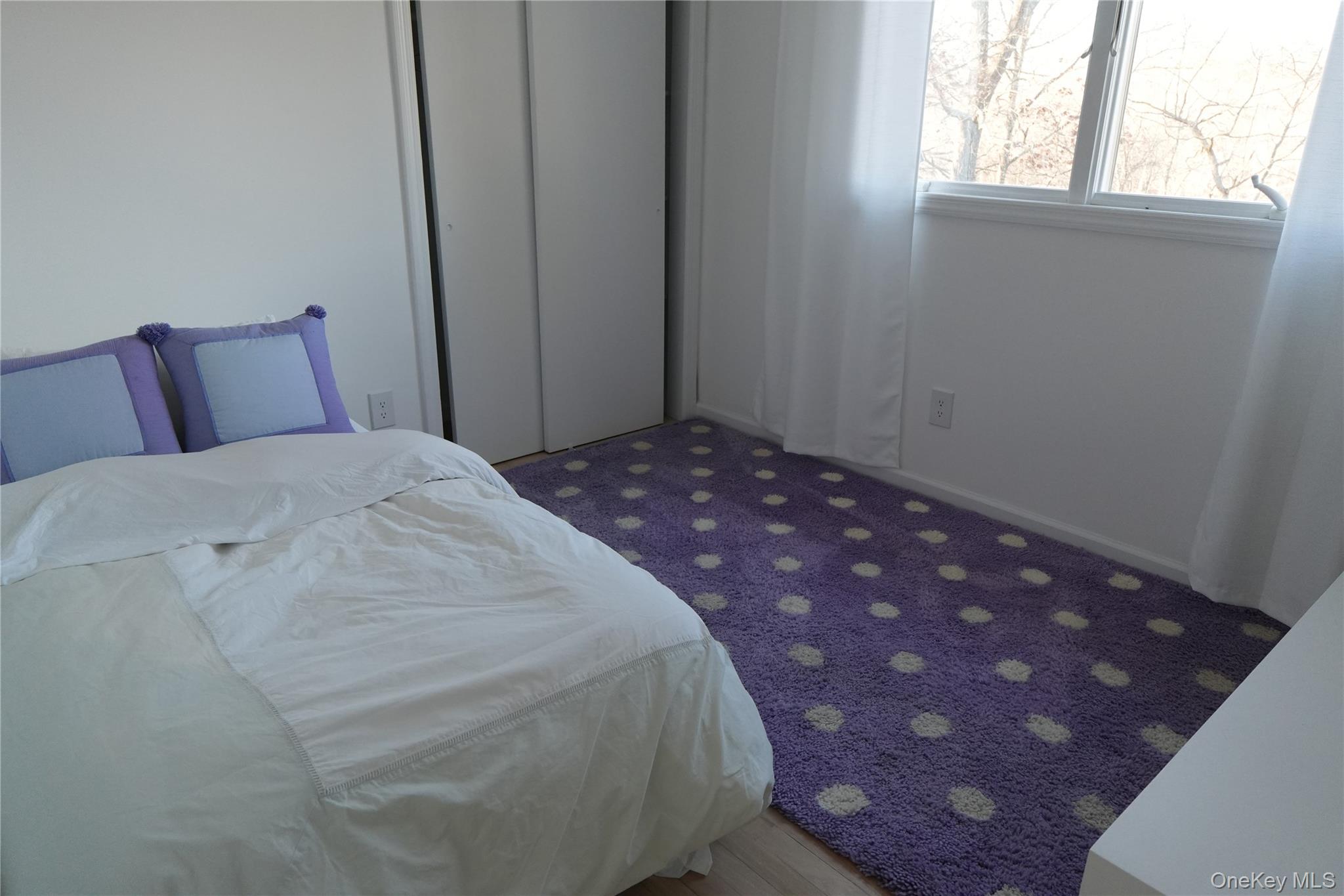 371 South River Road Calverton, NY 11933 - Photo 15 of 24 a bedroom with a bed and a window