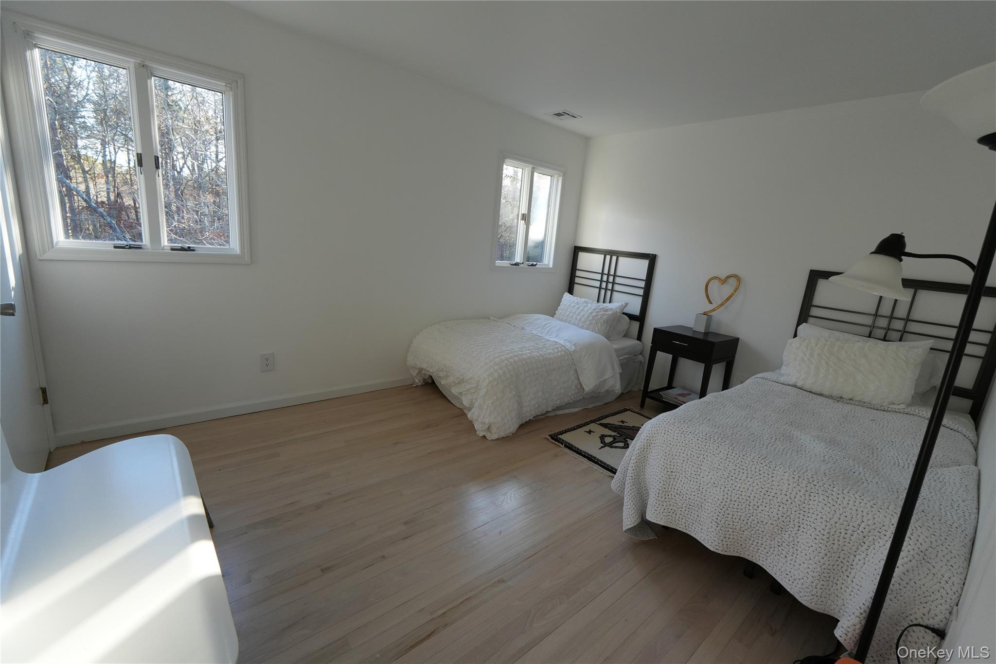 371 South River Road Calverton, NY 11933 - Photo 19 of 24 a bedroom with two beds and a window