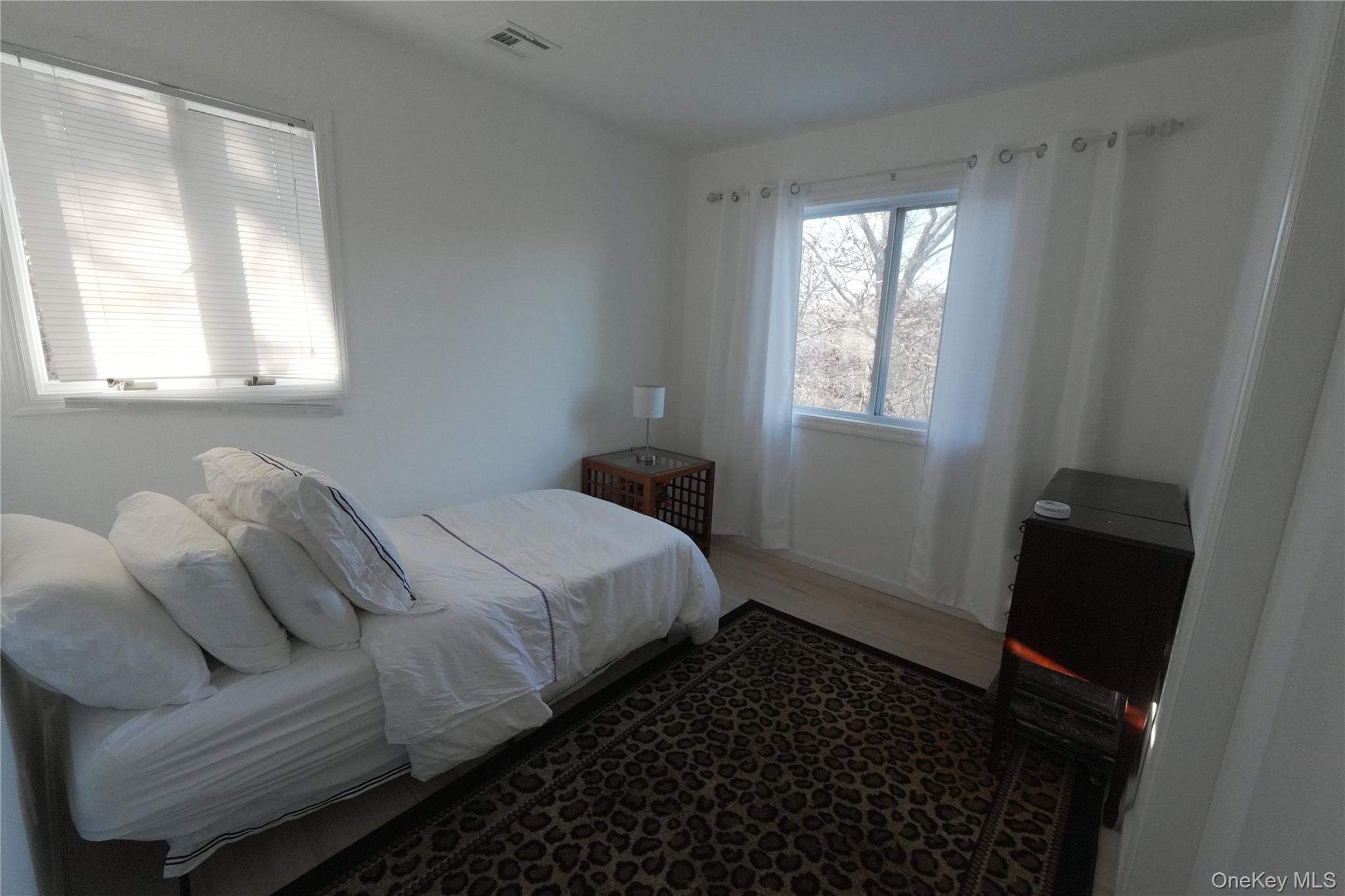 371 South River Road Calverton, NY 11933 - Photo 21 of 24 a bedroom with a bed and a window