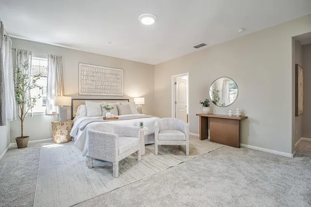 an empty room with closet and a bathroom