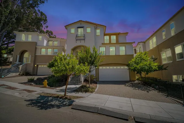 a view of entryway and hall with a front door