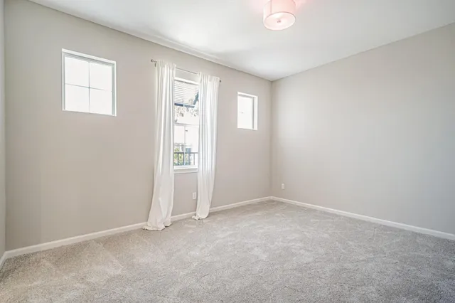 a bathroom with a granite countertop sink a toilet and a bathtub