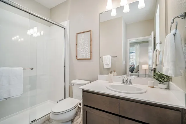 a aerial view of a house with yard and parking