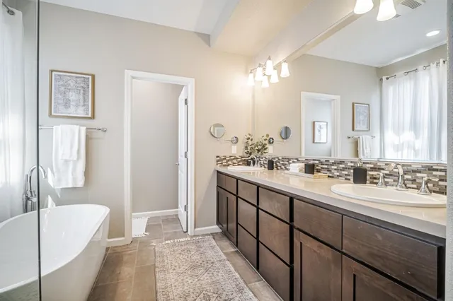 an aerial view of residential houses with outdoor space