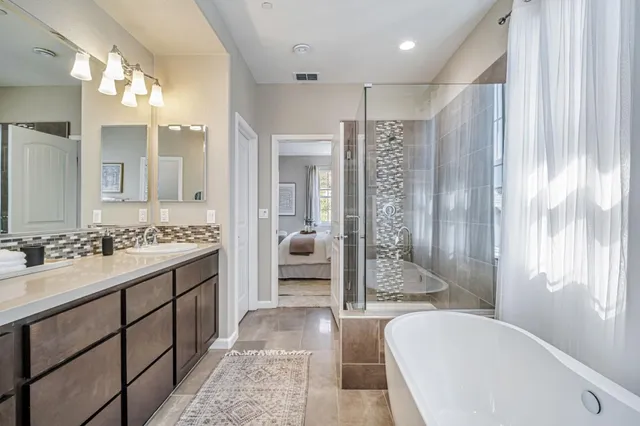 an aerial view of residential houses with outdoor space