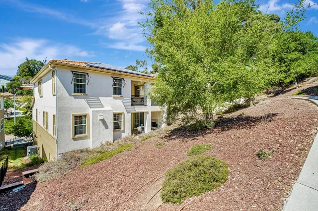 a view of a balcony with chairs