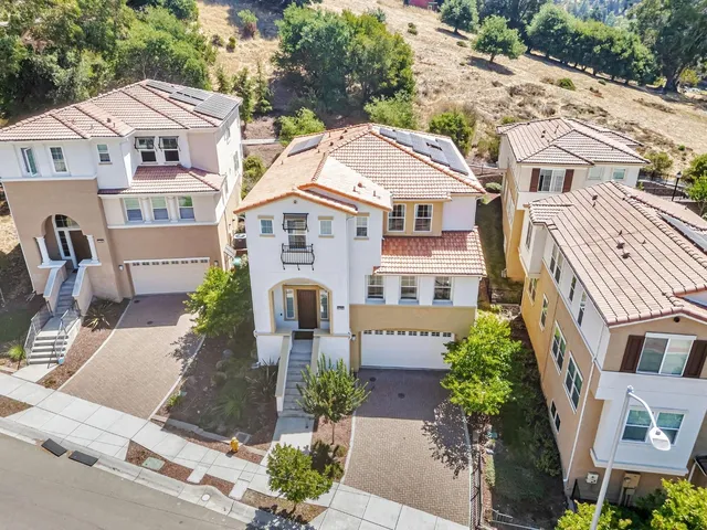 a view of a dining room with furniture and window