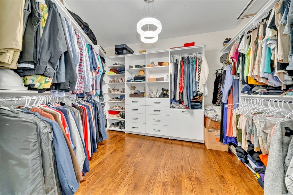 4 Lowell Street Lynnfield, MA 01940 - Photo 11 of 42 a view of walk in closet with clothes and shoes